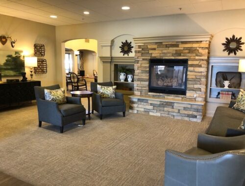 Magnolia Place community space with seating and fireplace